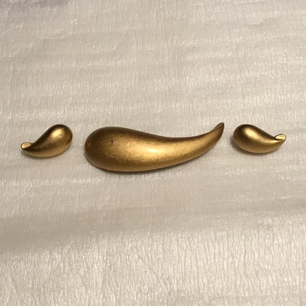 Vintage and very lovely gold tone Trifari brooch and earrings set